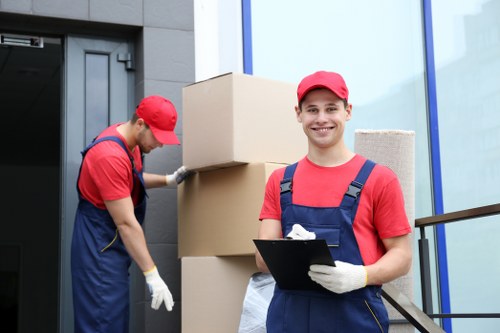 Student removals team handling boxes in a Richmond residential street