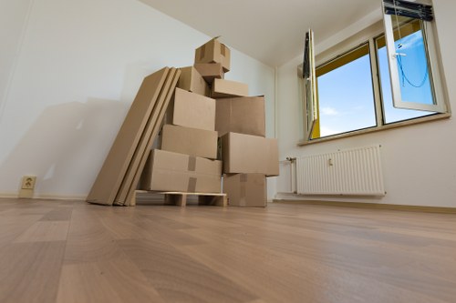 Trained mover using protective handling methods during a house move