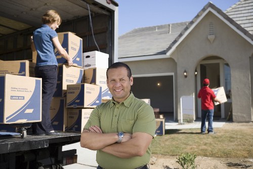 Local team collecting old furniture from a Richmond property with access challenges