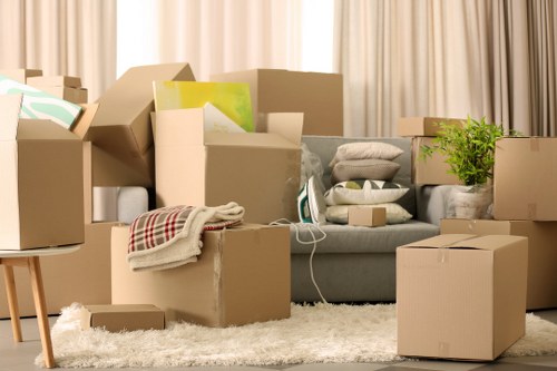 Local movers packing office equipment for a Richmond business relocation
