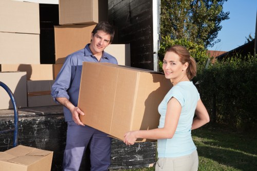 Professional movers handling furniture during a local relocation